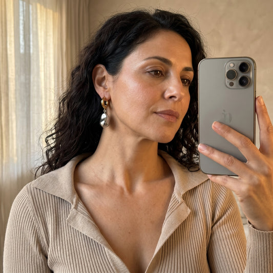 A Bicolor Single Earring With A Silver Pearl Pendant