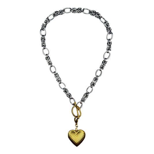 Silver Necklace With A Golden Heart