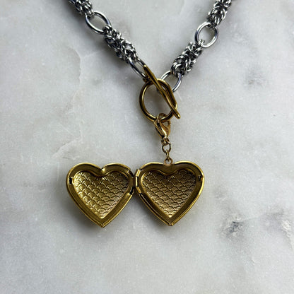 Silver Necklace With A Golden Heart