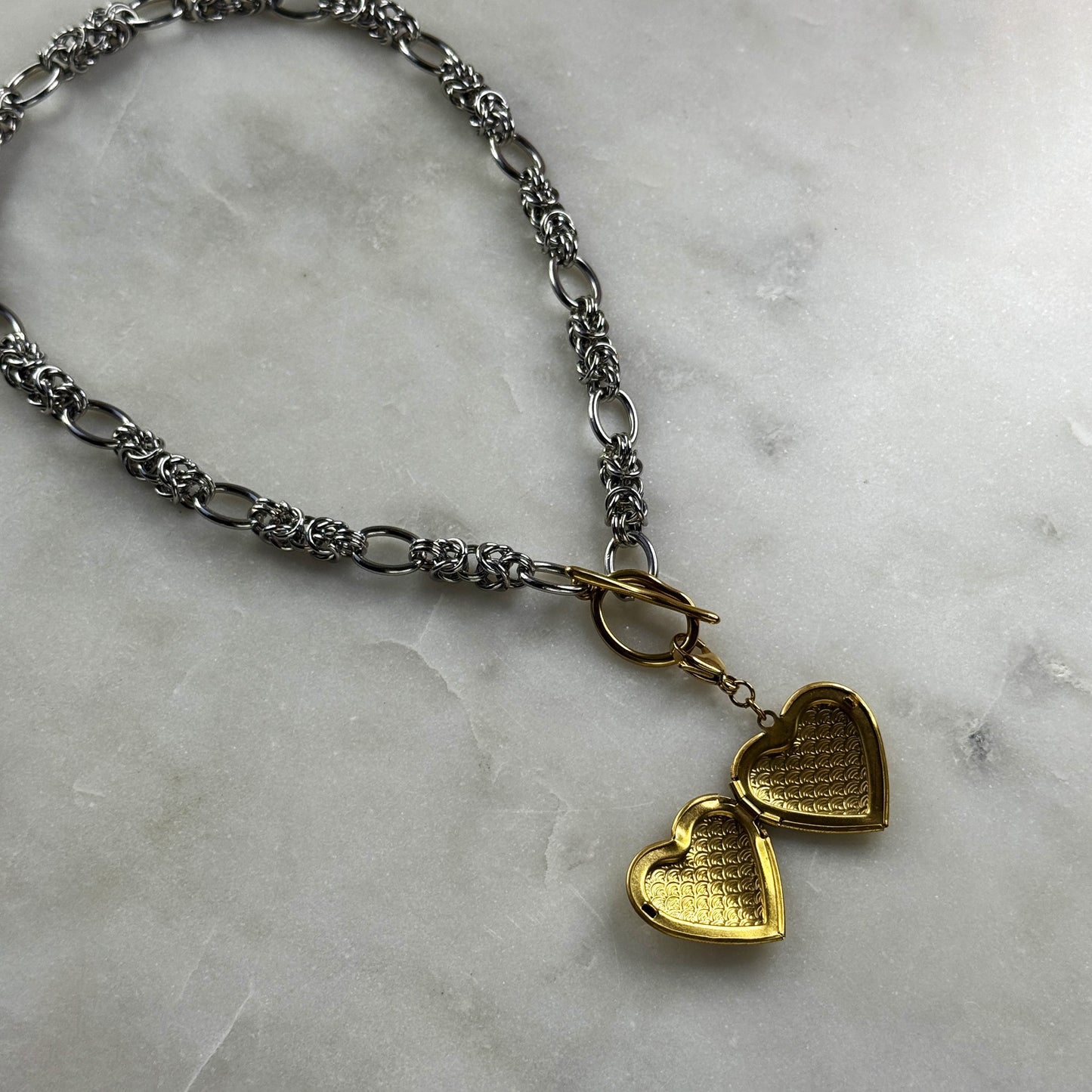 Silver Necklace With A Golden Heart