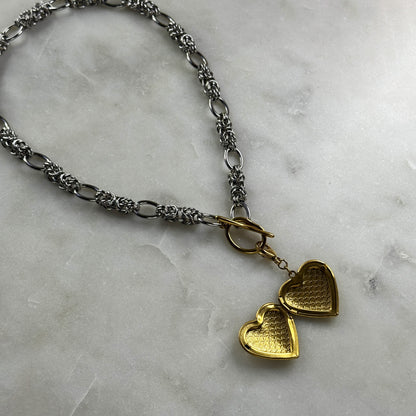 Silver Necklace With A Golden Heart