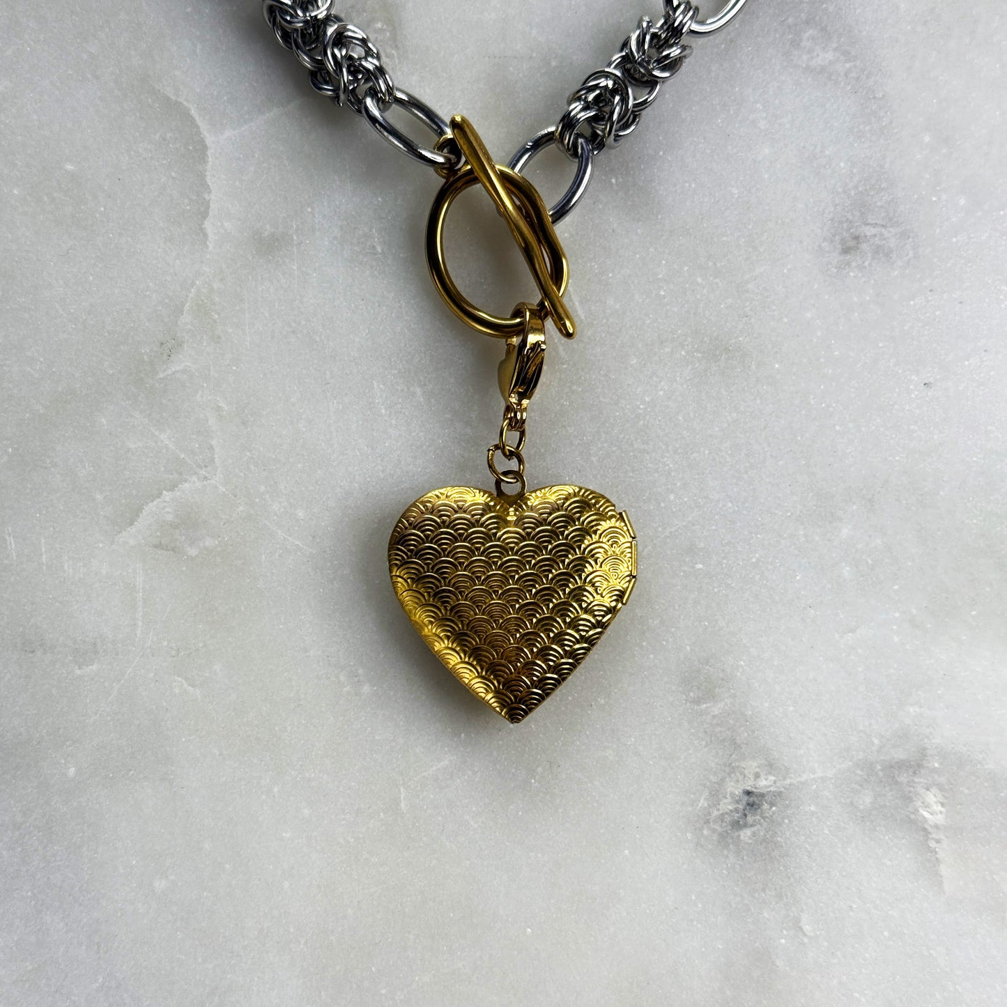 Silver Necklace With A Golden Heart